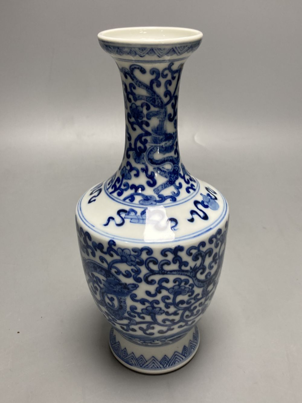 A Chinese blue and white dragon design vase, height 25cm